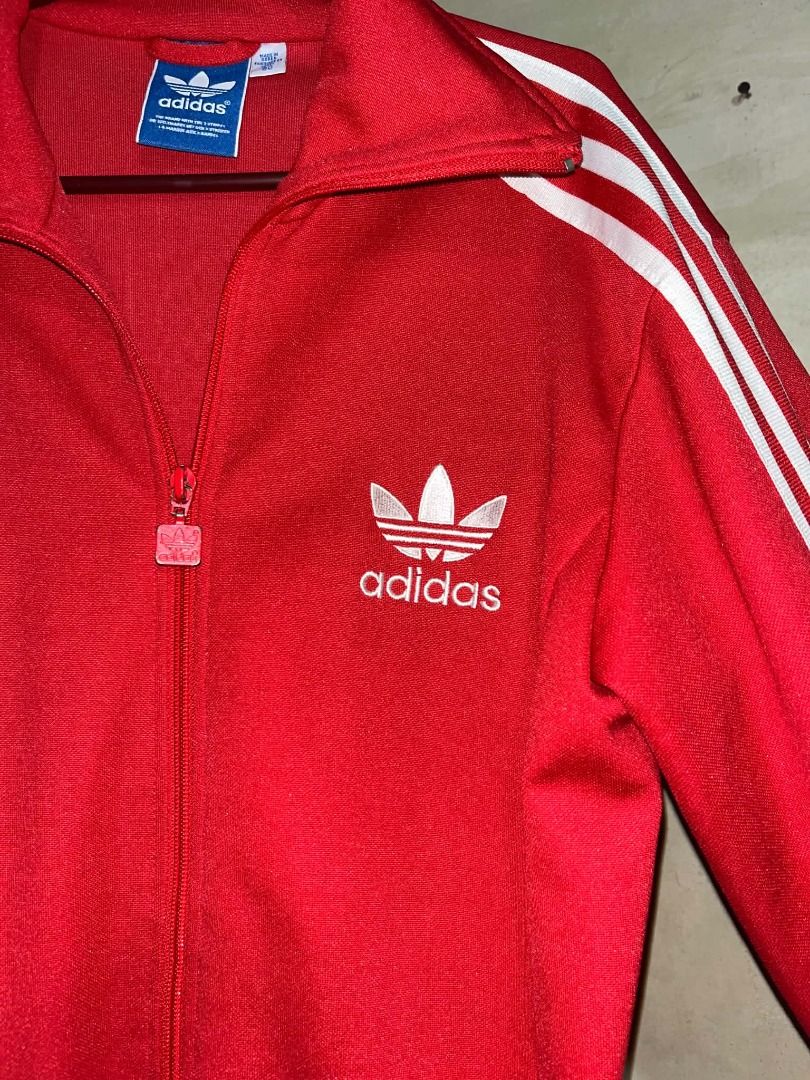 Adidas Red Track Jacket (Category: Coats, Jackets and Outerwear) located in Rizal. Submitted by sieneselieee (Listing ID 1467061644, Image 1). Description: ADIDAS TRACK JACKET RED PHP 1,000 Excellent Condition Color rate: 9.5/10 No issue Size Large 27” L 20W.