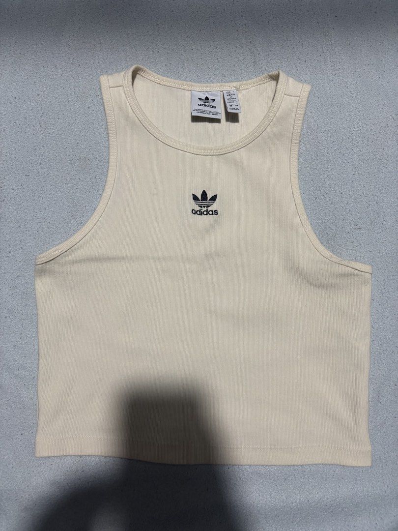 Adidas ribbed tank top (Category: Activewear) located in Pasig City. Submitted by dealwithgia (Listing ID 1467025019, Image 2). Description: strechy fabric medium size 9/10 condition.