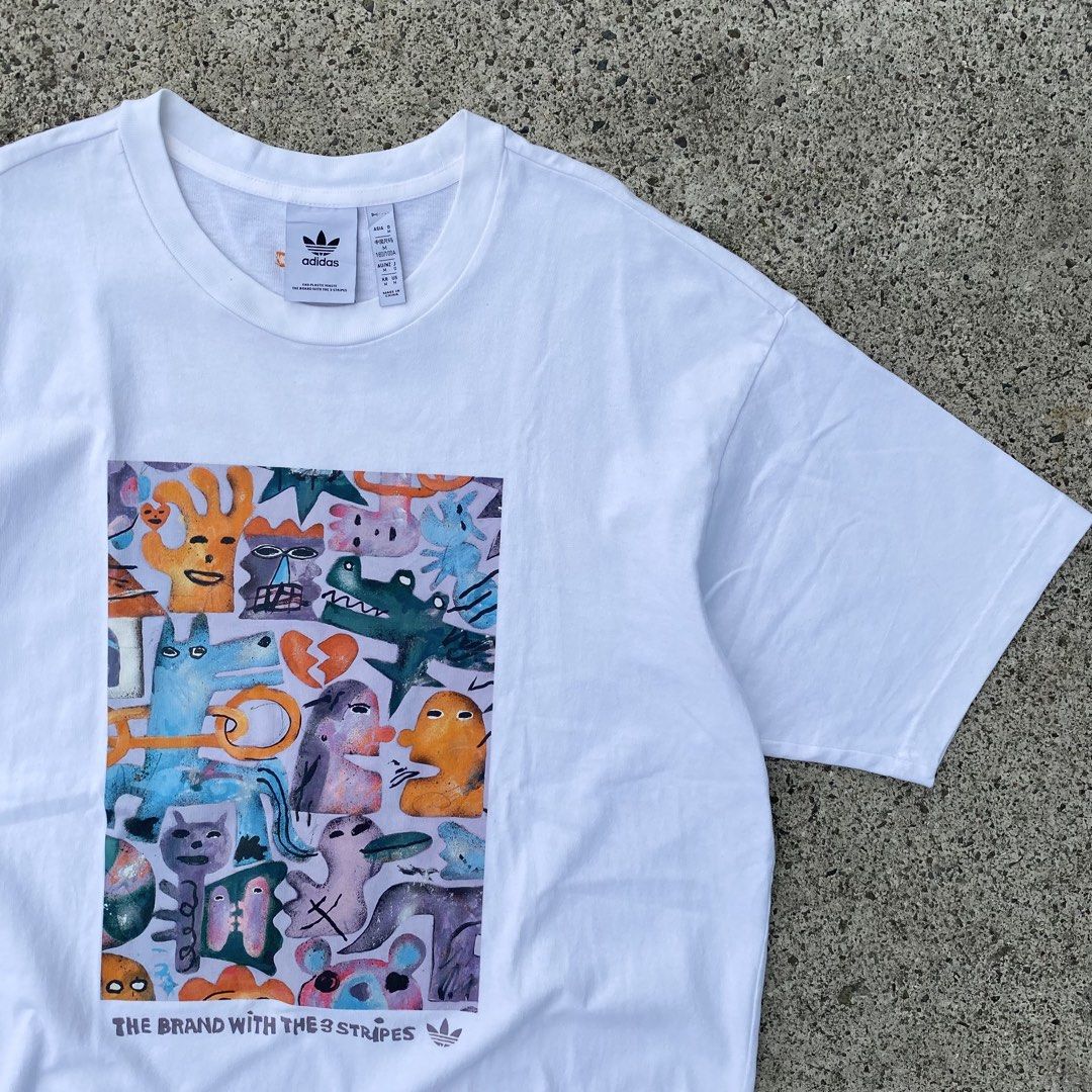 Adidas shirt (Category: Tshirts & Polo Shirts ) located in Lapu-Lapu City. Submitted by larry_oliver (Listing ID 1467133850, Image 2). Description: Adidas chest pattern cartoon shirt! Fit large Dimension 22W x 28L Condition 9.5/10 Color rate 9.5/10 Issue: minimal stain 450🏷️.