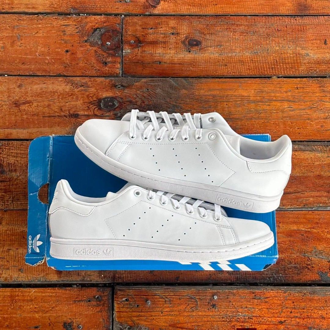 Adidas Stan Smith White Sneakers with Box (Category: Sneakers) located in Bulacan. Submitted by roberto.encarnado (Listing ID 1467029330, Image 1). Description: - Brand: Adidas Stan Smith - Color: Classic White - Material: Clean leather upper with perforated three stripes - Closure: Traditional lace-up front - Style: Timeless low-top design, goes with any casual outfit - Inclusion: Original blue and white shoebox included.