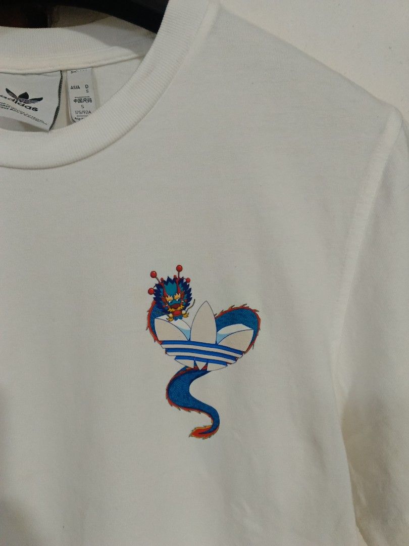 Adidas Tee (Category: Tshirts & Polo Shirts ) located in Cebu City. Submitted by authenticgrids (Listing ID 1467127146, Image 2). Description: Adidas Tee Graphic Printed Tee Excellent/ Good as New💯 Size on Tag 🏷️ Small Dimensions Width 19 inches Length 27 inches 📥📥📥📥📥📥 DM us for more details.