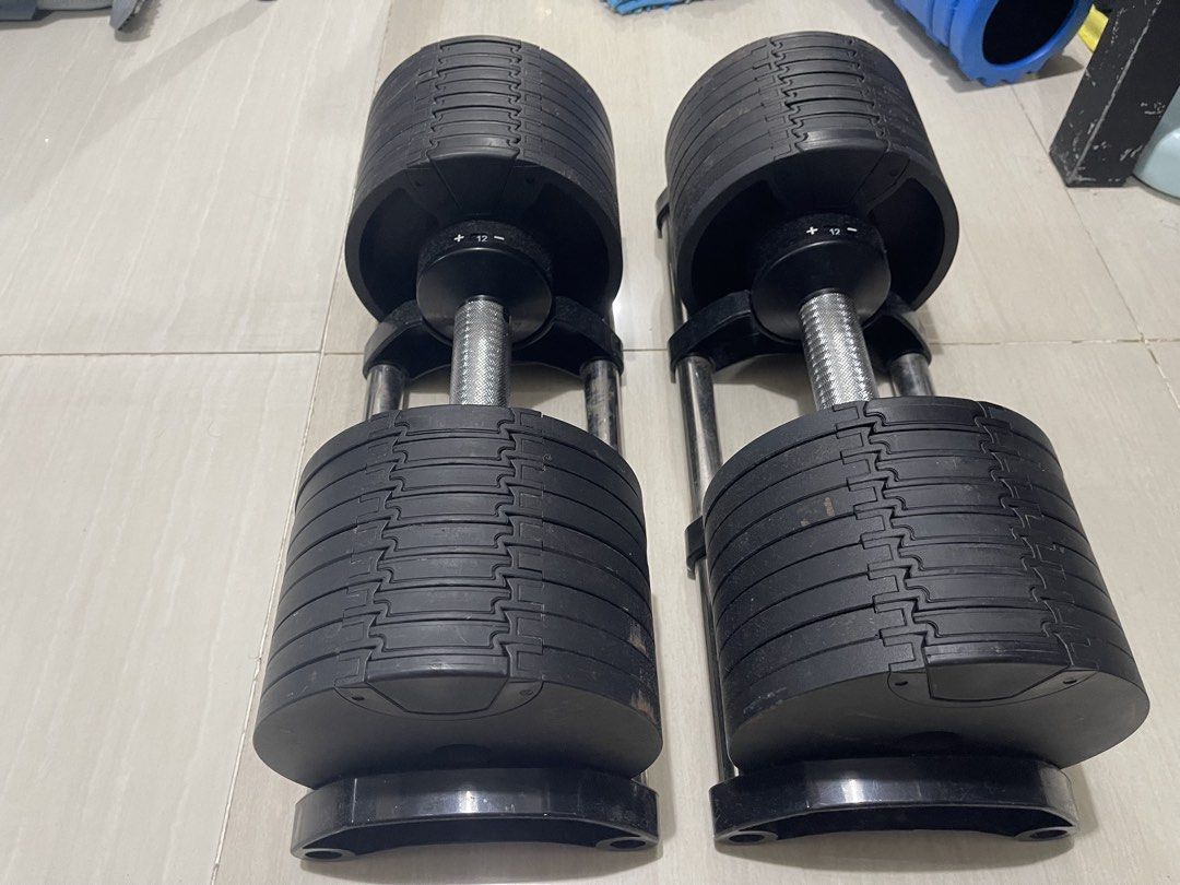 Adjustable Dumbbells Set with Weight Plates (Category: Weights & Dumbbells) located in Manila. Submitted by anrmarchad69199 (Listing ID 1467077035, Image 2). Description: - Pair of adjustable dumbbells with space-saving design - Replaces multiple dumbbell sets for home workouts - Metal knurled handles ensure a solid, secure grip - Easy end-adjustment mechanism with weight indicators up to 12 - Includes sturdy metal base trays to safely hold plate