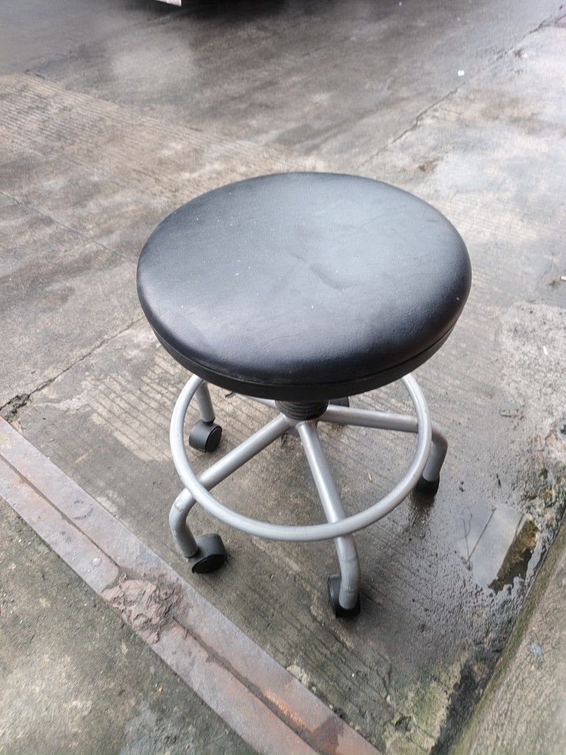 Adjustable rolling stool black seat silver base (Category: Chairs) located in Valenzuela. Submitted by kendra071914 (Listing ID 1466993326, Image 3). Description: - Condition: Brand New/Excellent - Adjustable height: 53cm to 66cm with easy-to-use lever - Comfortable round black padded seat (35cm diameter) - Sturdy silver metal frame with a built-in circular footrest ring - Smooth-rolling 5 caster wheels for easy mobility - Sleek center post with 