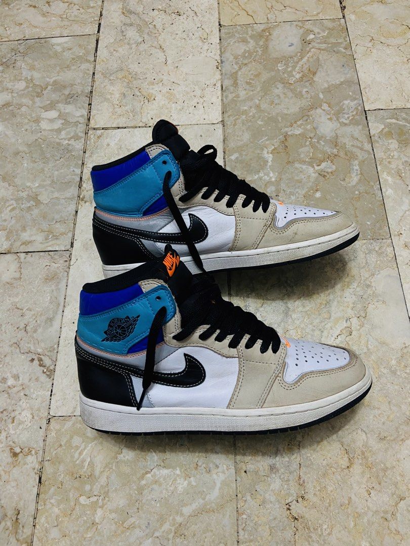 Air Jordan 1 Retro High OG Prototype (Category: Sneakers) located in Manila. Submitted by supersergio (Listing ID 1467018876, Image 3). Description: - Model: Air Jordan 1 Retro High OG Prototype - Size: US 8.5 / UK 7.5 / EUR 42 - Colorway: White base, beige overlays, black swoosh, blue ankle collar with orange accents - Condition: Normal usage wear on suede panels and midsoles; clean outsoles and solid structure intact - Ideal for: Everyday rotat