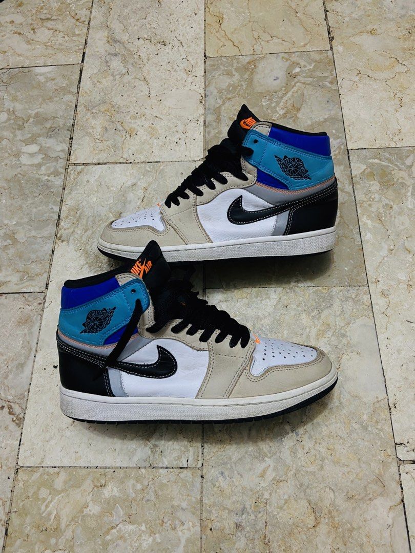 Air Jordan 1 Retro High OG Prototype (Category: Sneakers) located in Manila. Submitted by supersergio (Listing ID 1467018876, Image 1). Description: - Model: Air Jordan 1 Retro High OG Prototype - Size: US 8.5 / UK 7.5 / EUR 42 - Colorway: White base, beige overlays, black swoosh, blue ankle collar with orange accents - Condition: Normal usage wear on suede panels and midsoles; clean outsoles and solid structure intact - Ideal for: Everyday rotat