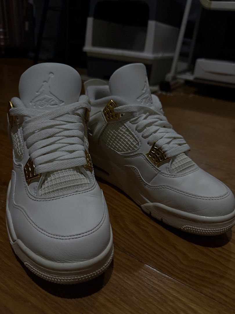 Air Jordan 4 Metallic Gold White (Category: Sneakers) located in Quezon City. Submitted by jajachandesu (Listing ID 1467108356, Image 1). Description: - Model: Air Jordan 4 Retro - Colorway: White with shiny gold eyelets - Condition: like new. Only worn twice. No original box. Bought from nike app upon release. RFS: Jordan shoes are not for me huhu Size: us 7.5 womens .