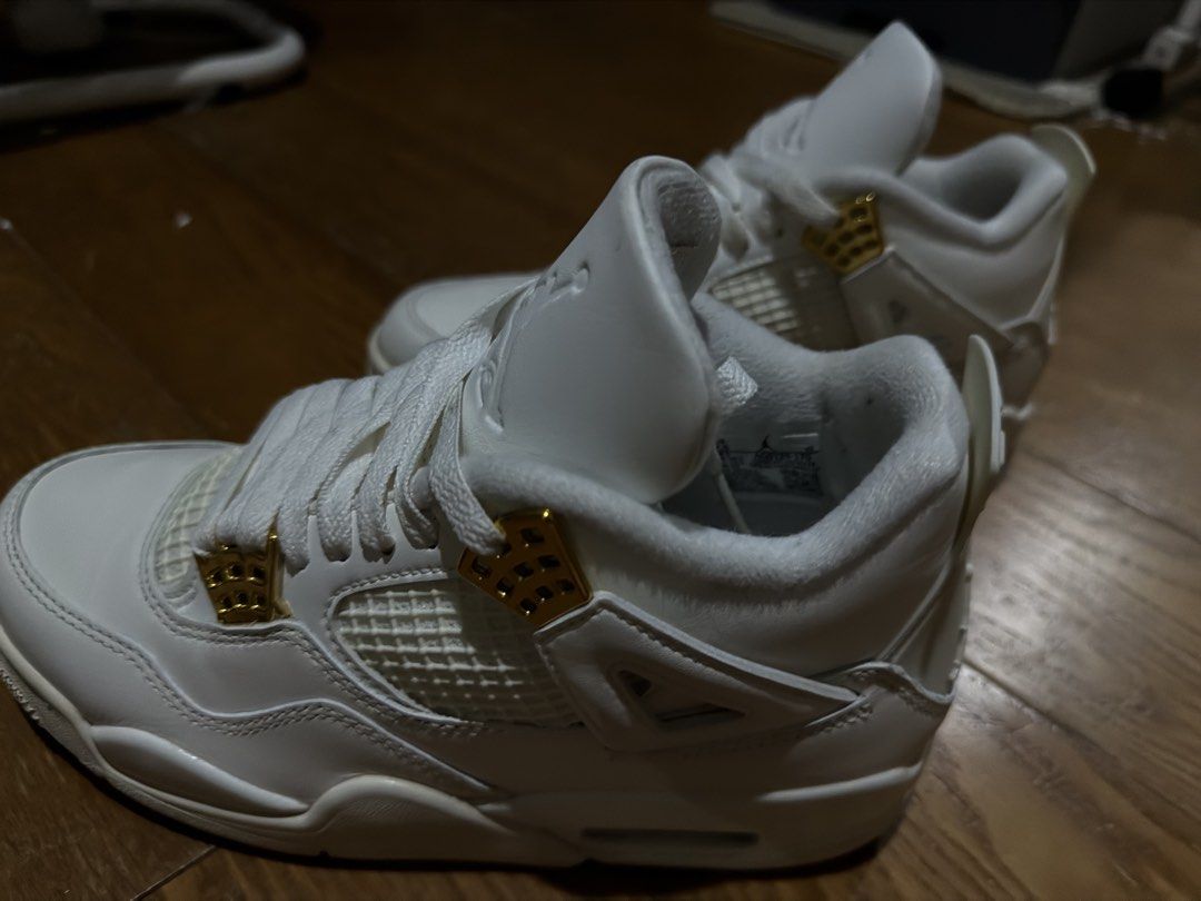 Air Jordan 4 Metallic Gold White (Category: Sneakers) located in Quezon City. Submitted by jajachandesu (Listing ID 1467108356, Image 2). Description: - Model: Air Jordan 4 Retro - Colorway: White with shiny gold eyelets - Condition: like new. Only worn twice. No original box. Bought from nike app upon release. RFS: Jordan shoes are not for me huhu Size: us 7.5 womens .