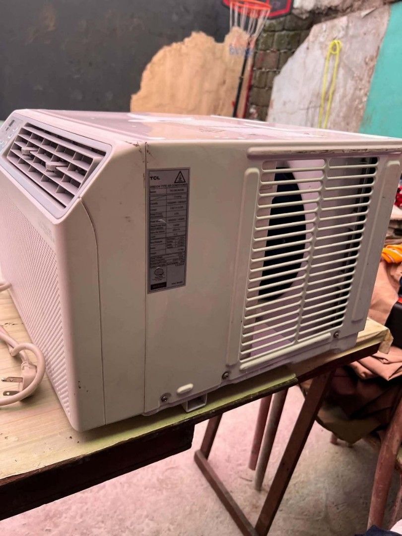 Aircon 1.5HP fully inverter window type (Category: Air Conditioning and Heating) located in Manila. Submitted by mika_ella (Listing ID 1467163285, Image 3). Description: - Brand: TCL Window Type Air Conditioner - Technology: AI Full DC Inverter Model - Color/Design: White finish, front control panel, adjustable louvers - Inclusions: Original remote control and power cord - Condition: Powers up normally, shows minor dirt marks on top and sides fro