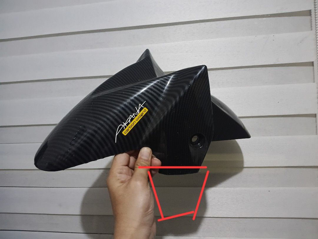 Akana Carbon Wizard Nmax v2 Front Fender (Category: Body Parts and Accessories) located in Manila. Submitted by unclevin29 (Listing ID 1467110636, Image 2). Description: - Issue putol turniltuhan sa left - Authentic Akana Carbon Wizard front fender - Real carbon fiber weave with a premium glossy finish - Lightweight yet durable construction - Pre-drilled mounting holes for hassle-free installation - Ideal as a stylish aesthetic upgrade or stock m