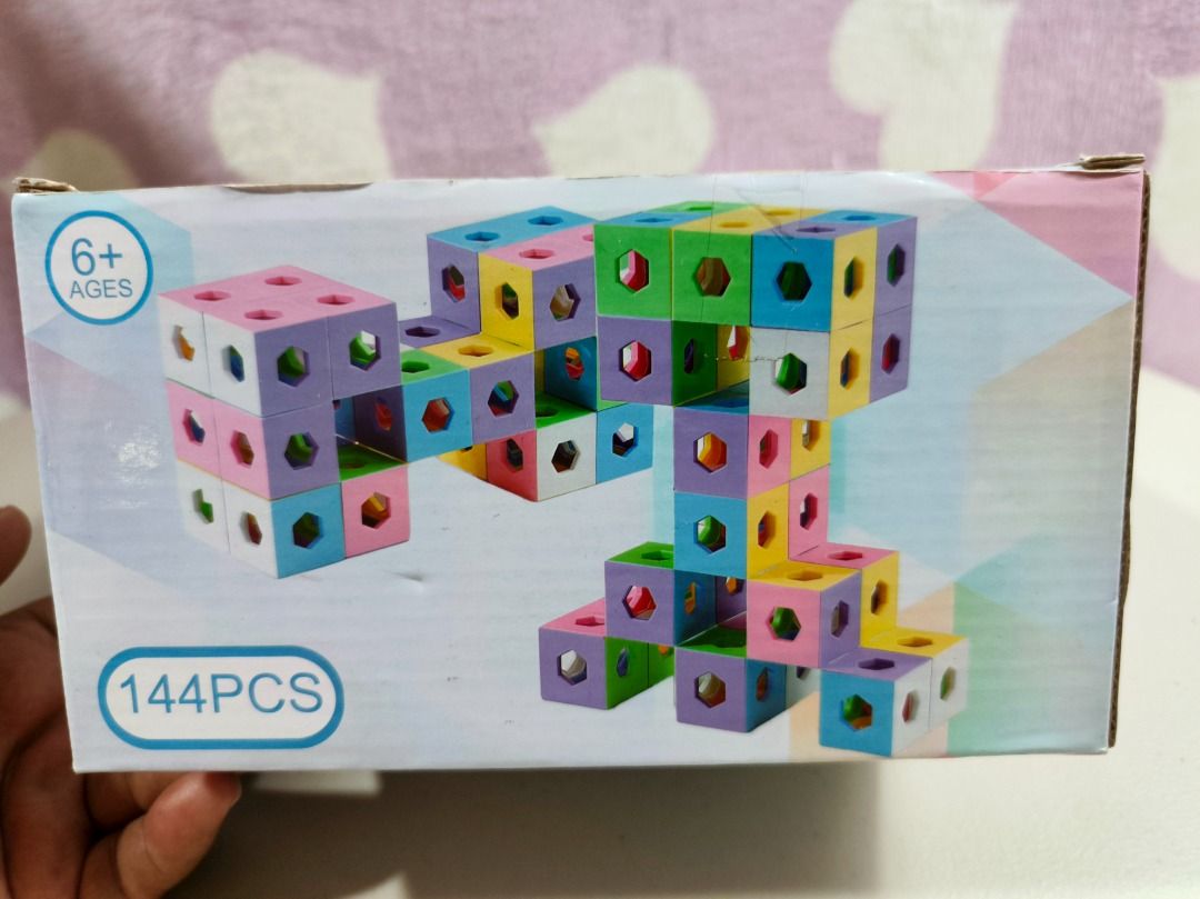 Akinashi Spatial Thinking Ghost Blocks Toy Set 144 PCS (Category: Lego & Building Sets) located in San Leonardo. Submitted by burgossanleonardo.12345 (Listing ID 1467103025, Image 1). Description: - Brand: Akinashi Spatial Thinking Ghost Blocks Puzzle Set - Piece count: 144 colorful pastel cubes featuring geometric cutout designs - Recommended age: Great for kids 6 years and up - Skills developed: Enhances spatial thinking, creativity, and struct