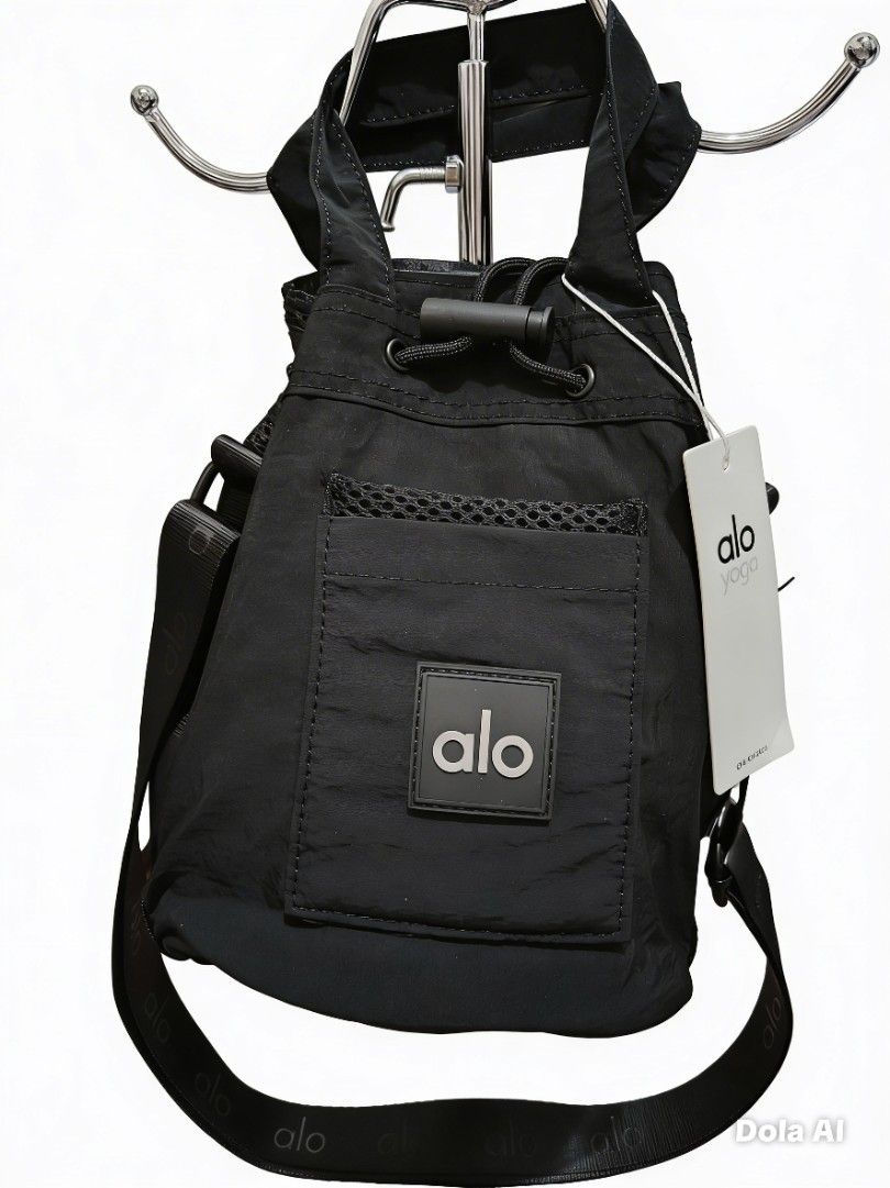 Al0 Y0ga drawstring bucket bag (Category: Cross-body Bags) located in Makati City. Submitted by sweet21onlineshoppe (Listing ID 1467057489, Image 1). Description: - Condition: Brand new with tags attached - Versatile carry: Includes top handles and an adjustable shoulder strap - Secure storage: Drawstring closure with toggle - Extra storage: Exterior mesh-trimmed pocket with Alo logo patch - Color options: Available in Black and Gray - Ideal for 