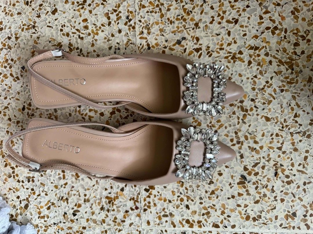 Alberto Heels Shoes (Category: Heels) located in San Juan City. Submitted by msmpatron (Listing ID 1467011566, Image 2). Description: - Brand: Alberto - Size: EU 39 - Color: Nude - Style: Slingback heels with pointed toe and low kitten heel - Feature: Eye-catching chunky crystal buckle on the front - Condition: Uppers are clean, soles show normal signs of previous use - Inclusions: Comes with original box original price:1599 Used once po with min