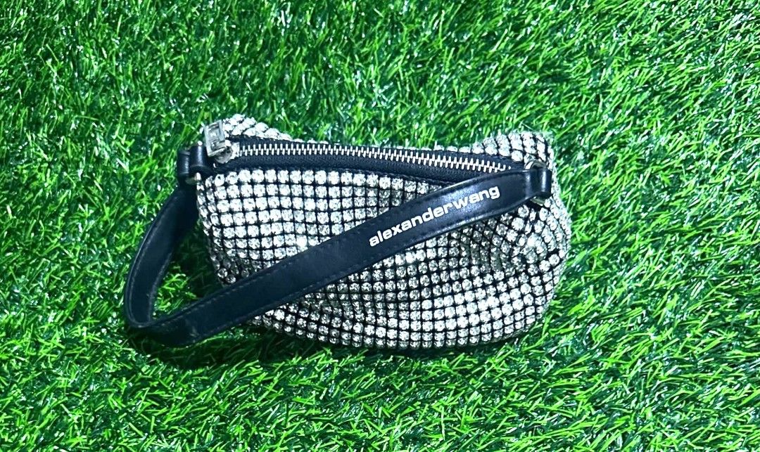 Alexander Wang Crystal Rhinestone Mesh Pouch (Category: Purses & Pouches) located in Antipolo. Submitted by saribymonica (Listing ID 1467089931, Image 1). Description: Alexander Wang Crystal Rhinestone Mesh Pouch. It is the perfect size for your phone, keys, lipstick, and cardholder. A must-have statement piece that easily dresses up any outfit! Condition Note: Gently used condition. Please note that 2 small rhinestones are missing from the mesh 