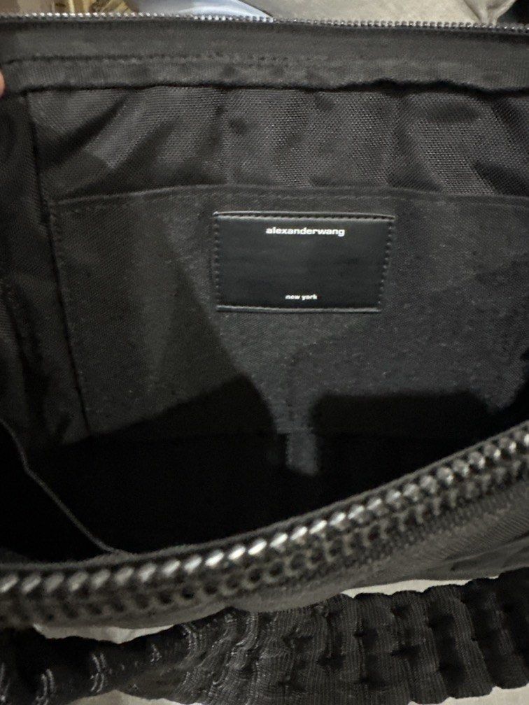 Alexander Wang Elite Tech Shoulder Bag (LAPTOP Bag) (Category: Other Mobile & Gadget Accessories) located in Manila. Submitted by krystalchewey_ (Listing ID 1467073319, Image 3). Description: Used Actual Photo Posted 1000php Laptop bag Flaws: tinangal yung brand ng bag sa harap AS-is • Laptop Capacity: Features a padded canvas lining specifically designed to fit a 13-inch laptop..