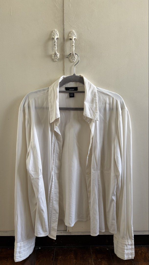 Alfani White Long Sleeve Button Down Shirt (Category: Longsleeves) located in Manila. Submitted by nanah0930 (Listing ID 1467004024, Image 1). Description: - Brand: Alfani - Color: Solid white - Size: S-M - Style: Classic button-down shirt with a relaxed fit - Details: Long sleeves with pleated cuffs and a classic collar - Material: Lightweight and comfortable fabric - Versatility: Ideal for workwear or casual outings, easy to mix and match with 