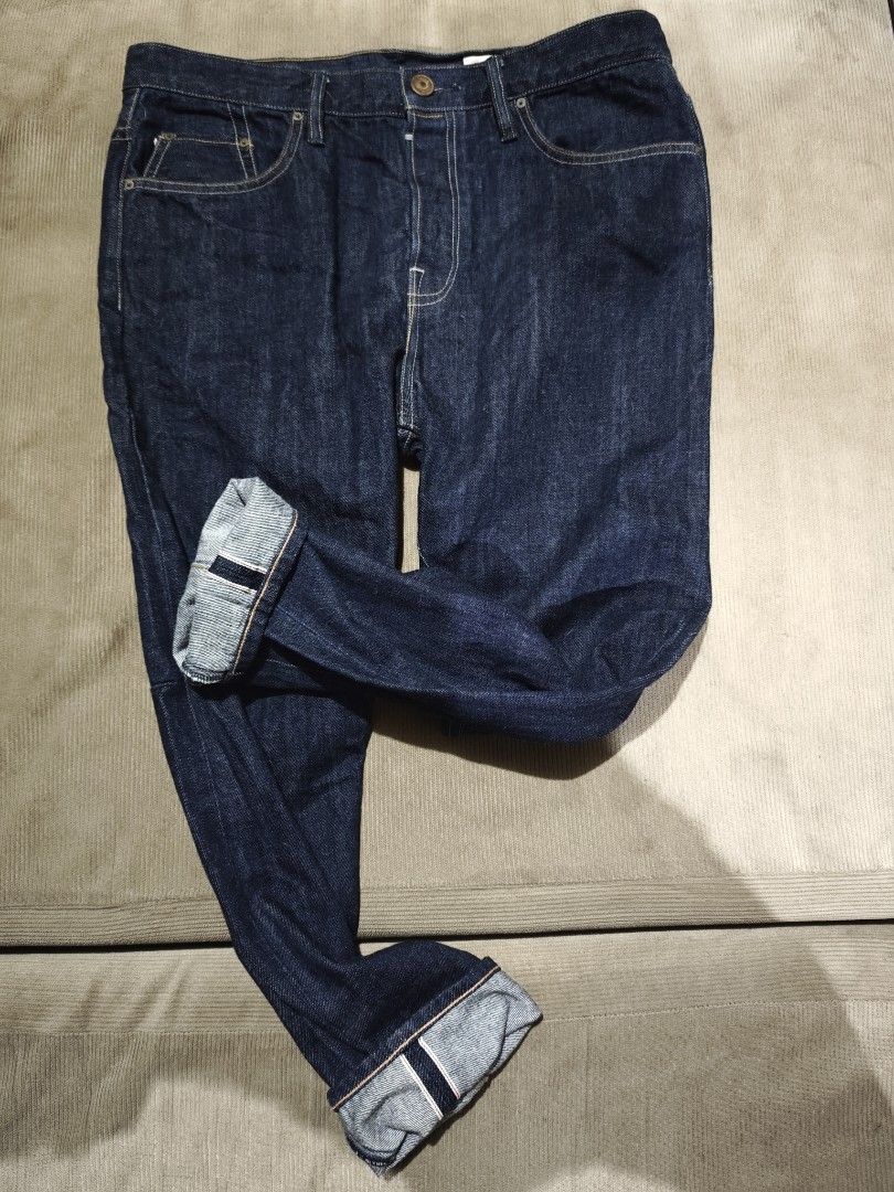 AllSaints Spitalfields Selvedge Denim Jeans (Category: Jeans) located in Quezon City. Submitted by naj.gnabiuq (Listing ID 1466996199, Image 3). Description: - Brand: AllSaints Spitalfields - Wash: Dark indigo with minimal fading - Material: Premium heavy selvedge denim with red-line ID on cuff - Fit: Straight leg cut - Details: Button fly, branded leather patch, and contrast topstitching - Condition: Excellent, versatile everyday wear - size ref