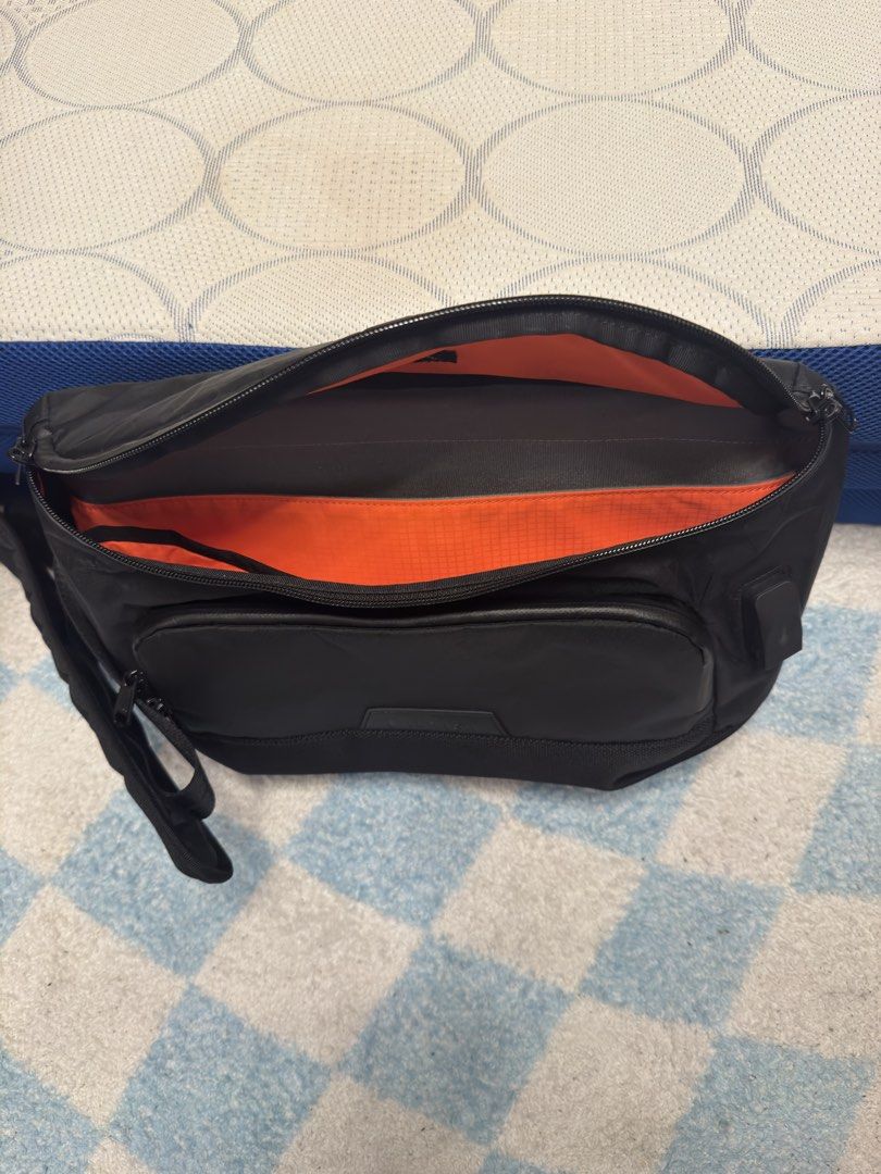 Alpaka Bravo Sling Max V2 (Category: Sling Bags) located in Quezon City. Submitted by rrgarcia (Listing ID 1467133619, Image 2). Description: - Brand: Alpaka Bravo Sling Max V2 - Color: Sleek black with a vibrant orange ripstop nylon lining - Material: Weather-resistant fabric with sturdy, smooth zippers - Storage: Front zippered pocket and integrated key loop - Comfort: Adjustable shoulder strap featuring a padded section and quick-release buckl