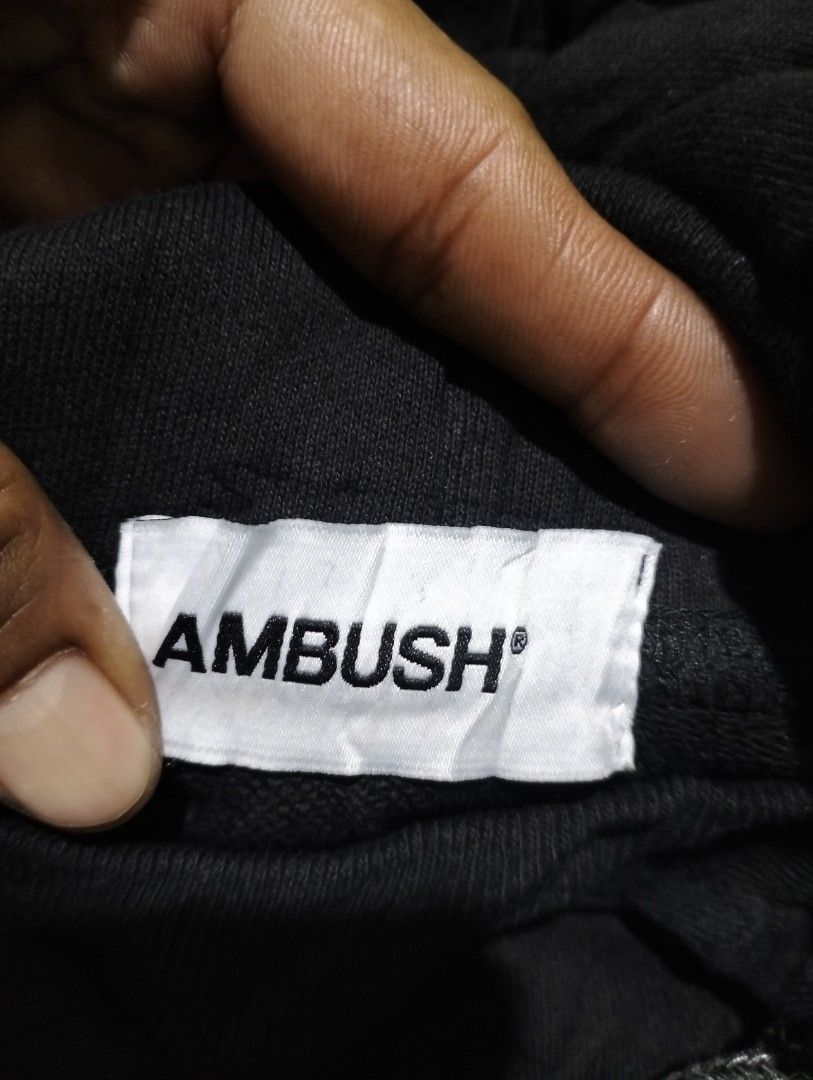 AMBUSH Black Drawstring Hoodie (Category: Hoodies) located in Taguig. Submitted by conniemdcruz (Listing ID 1467094587, Image 3). Description: - Brand: AMBUSH (Made in Japan) - Material: 100% Cotton (Machine wash cold, line dry) - Color: Black with white chest logo - Size: Label Size 1 - Special Features: Unique multicolored braided drawstrings with silver metal tips and hardware - Condition: Excellent / Ready to ship - Mode of Payment: GCash, Ba