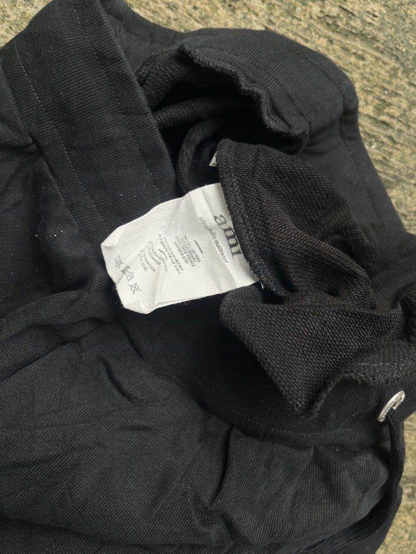Ami Paris Black Cotton Sweatshorts (Category: Shorts) located in Manila. Submitted by shanaaa.collects (Listing ID 1466973049, Image 3). Description: - Brand: Ami Paris - Item: Black Cotton Sweatshorts - Condition: Brand new / Excellent - Material: Soft, premium cotton - Details: Tonal embroidered heart logo, branded silver eyelets and metal tips, drawstring waistband, two side pockets - Origin: Made in Portugal - Fit: Relaxed, comfortable lounge