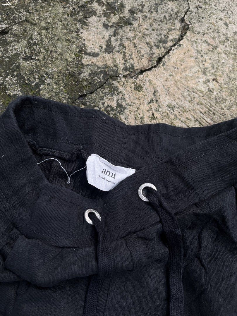Ami Paris Black Cotton Sweatshorts (Category: Shorts) located in Manila. Submitted by shanaaa.collects (Listing ID 1466973049, Image 2). Description: - Brand: Ami Paris - Item: Black Cotton Sweatshorts - Condition: Brand new / Excellent - Material: Soft, premium cotton - Details: Tonal embroidered heart logo, branded silver eyelets and metal tips, drawstring waistband, two side pockets - Origin: Made in Portugal - Fit: Relaxed, comfortable lounge