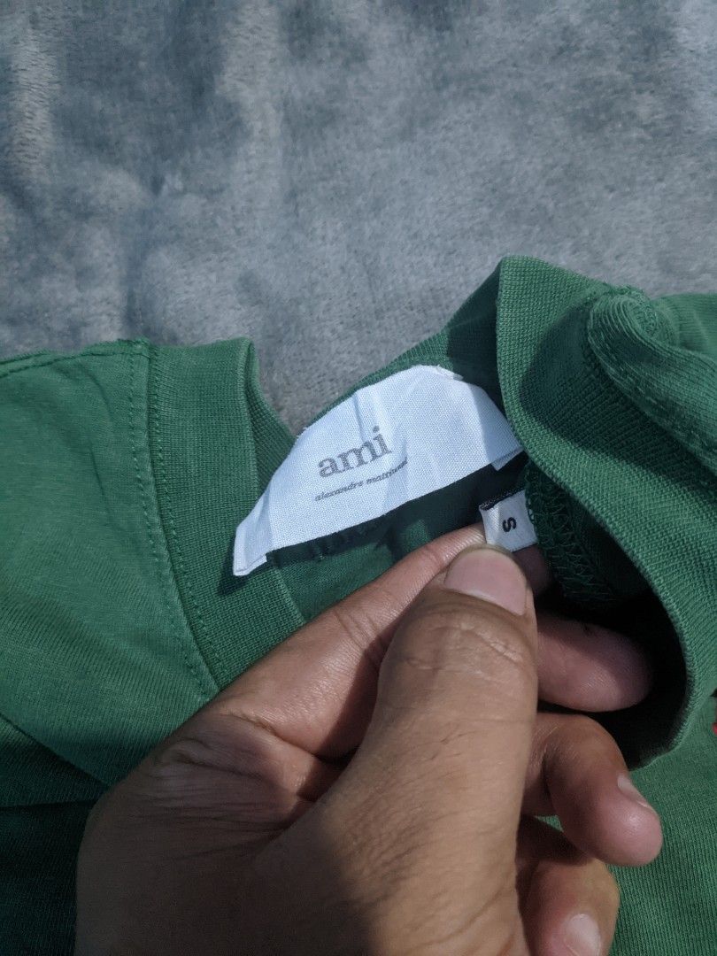 Ami Paris Green T-Shirt (Category: Tshirts & Polo Shirts ) located in San Ildefonso. Submitted by tripniberto (Listing ID 1467139140, Image 2). Description: Ami Dimes:20w/26L Issue: Need wash, not sure kung bleach stain, sign of use Color Rate: 7.5/10(or better) naging pa acid wash (lighting may affect the color on images) MOP: gcash MOD: j&t(+sf) NO RUSH SHIPPING!!! (3-5days Ship out!) please manage your expectations this is ukay items PM if int