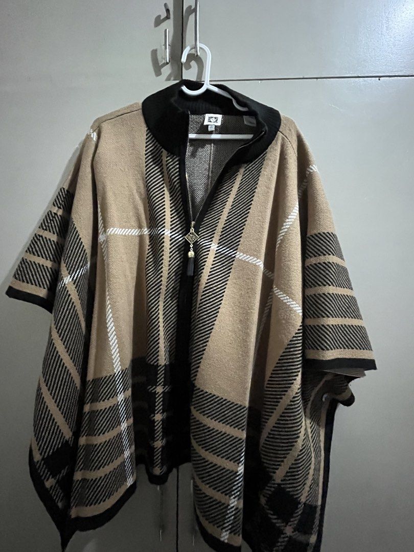 Anne Klein Plaid Zip-Front Poncho Size M (Category: Coats, Jackets and Outerwear) located in Quezon City. Submitted by iamina16 (Listing ID 1467132825, Image 2). Description: - Brand: Anne Klein - Style: Cozy knit poncho with high ribbed collar - Pattern: Classic tan, black, and white plaid - Closure: Full front zipper with decorative pull - Size: Medium (tag attached) - Origin: Made in China - Condition: Excellent.