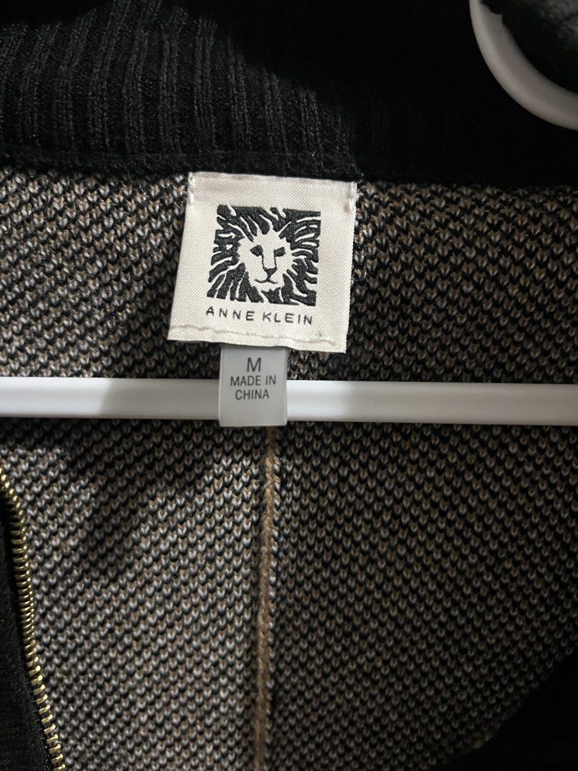 Anne Klein Plaid Zip-Front Poncho Size M (Category: Coats, Jackets and Outerwear) located in Quezon City. Submitted by iamina16 (Listing ID 1467132825, Image 1). Description: - Brand: Anne Klein - Style: Cozy knit poncho with high ribbed collar - Pattern: Classic tan, black, and white plaid - Closure: Full front zipper with decorative pull - Size: Medium (tag attached) - Origin: Made in China - Condition: Excellent.