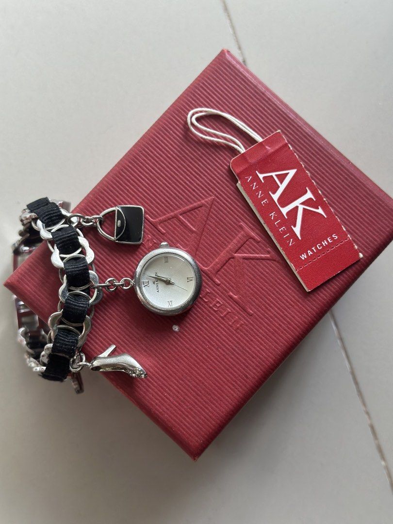 Anne Klein Silvertone Charm Bracelet Watch (Category: Women's Watches) located in Pasig City. Submitted by claysome (Listing ID 1466994344, Image 1). Description: Anne Klein Silvertone Charm Bracelet Watch -Comes with Original Box -10/10 .