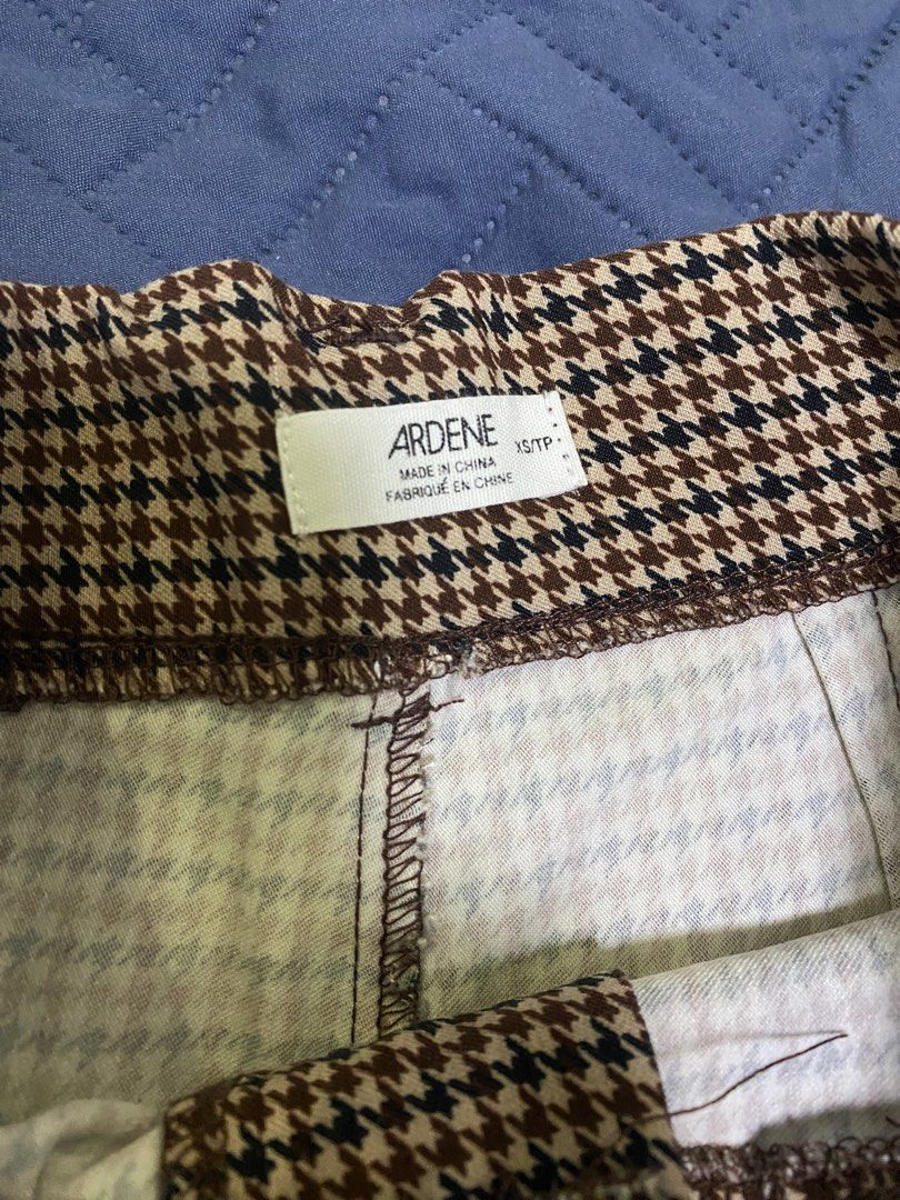 Ardene Brown Houndstooth Flare Pants (Category: Jeans) located in Manila. Submitted by escherichiaa (Listing ID 1467110030, Image 3). Description: - Brand: Ardene - Size: XS - Pattern: Brown & black houndstooth - Style: High-waisted flare pants with front button closure - Fit: Fitted through the thigh with a bottom flare - Fabric: Stretchy and super comfortable.