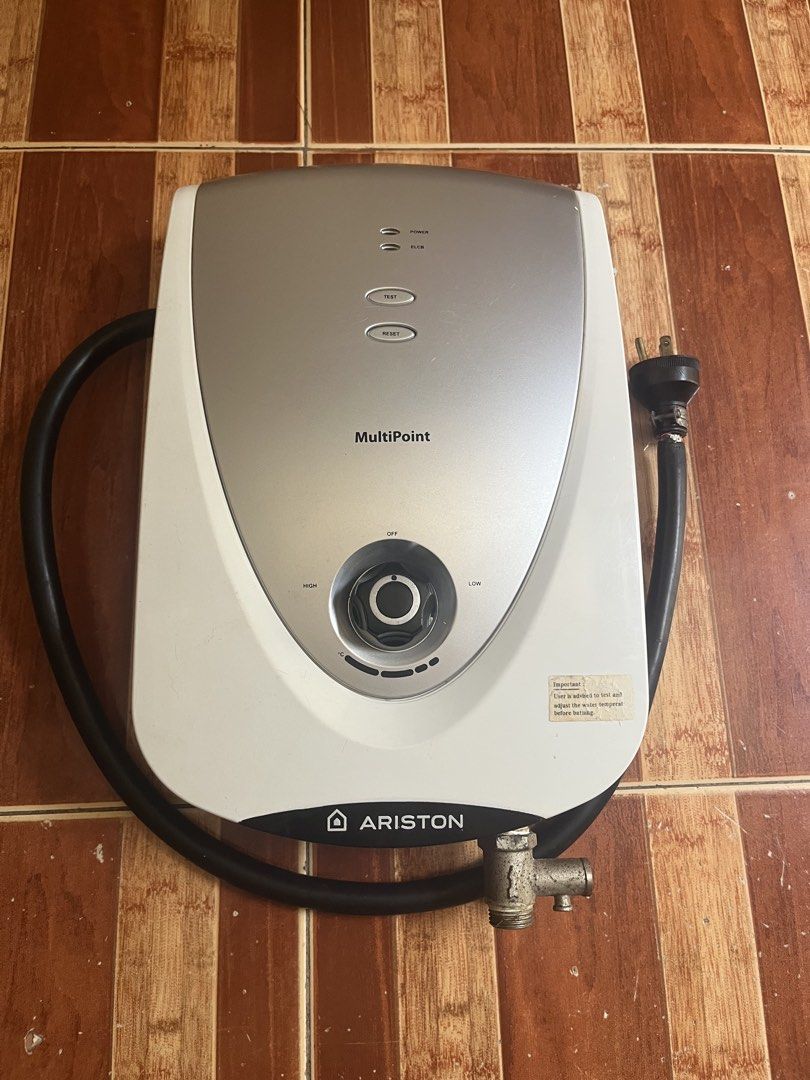 Ariston MultiPoint Instant Water Heater (Category: Water Heater & Instant Showers) located in Mandaluyong City. Submitted by ekatipunan.oxychem (Listing ID 1467093392, Image 1). Description: - Brand/Model: Ariston MultiPoint Instantaneous Water Heater - Color: White and Silver - Condition: Used, fully intact and working well - Controls: Central dial for easy temperature adjustment (High/Low) - Safety Features: Test and reset buttons with ELCB ind