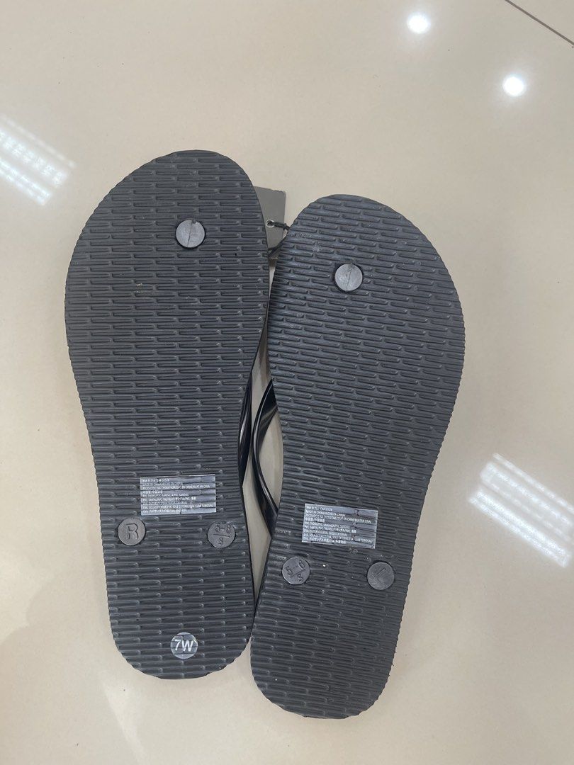 Armani Exchange Flip Flops Size 7W (Category: Slippers and slides) located in Bauang. Submitted by Fuzakenn (Listing ID 1466989217, Image 3). Description: Armani Exchange thong sandals in black. Grey translucent straps with gold-tone metal brand plate. Textured footbed with embossed A/X logo on the heel. Size 7W. Brand new with original tags attached showing twenty-five dollars retail price. ALL DETAILS POSTED NO ISSUE LA UNION J&T/JRS EXPRESS GC