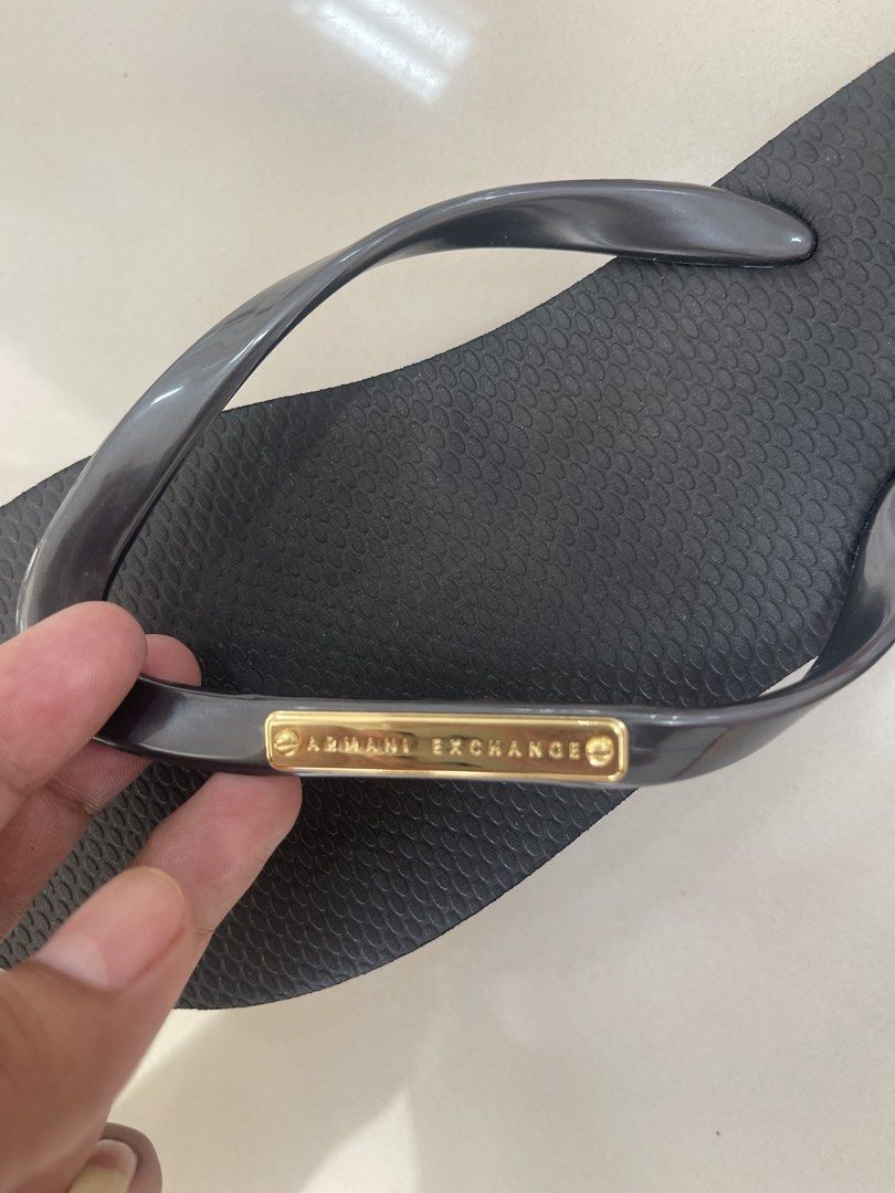Armani Exchange Flip Flops Size 7W (Category: Slippers and slides) located in Bauang. Submitted by Fuzakenn (Listing ID 1466989217, Image 2). Description: Armani Exchange thong sandals in black. Grey translucent straps with gold-tone metal brand plate. Textured footbed with embossed A/X logo on the heel. Size 7W. Brand new with original tags attached showing twenty-five dollars retail price. ALL DETAILS POSTED NO ISSUE LA UNION J&T/JRS EXPRESS GC