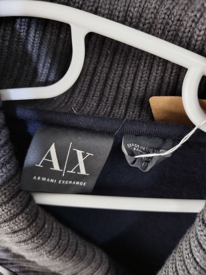 Armani Exchange Navy Blue Shawl Collar Sweatshirt (Category: Coats, Jackets and Outerwear) located in Binan City. Submitted by makinpeso0622 (Listing ID 1467064532, Image 2). Description: - Brand: Armani Exchange - Color: Navy blue with thick ribbed grey shawl collar and toggles - Details: Long sleeves, banded cuffs and hem, small rubber logo patch near bottom - Material: Cotton-polyester blend shell; wool-nylon trim - Care: Machine washable cold