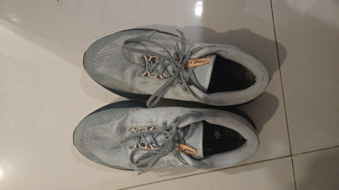 ASICS Novablast 5 Tr (Category: Sneakers) located in Mandaluyong City. Submitted by ohayouclub (Listing ID 1466993836, Image 2). Description: - Brand: ASICS - Cushioning: FF Blast MAX for premium comfort - Design: Grey mesh upper with stylish patterned laces and dark soles - Condition: Moderate tread wear and some dirt on fabric uppers - Status: Well-loved and ready for many more miles.