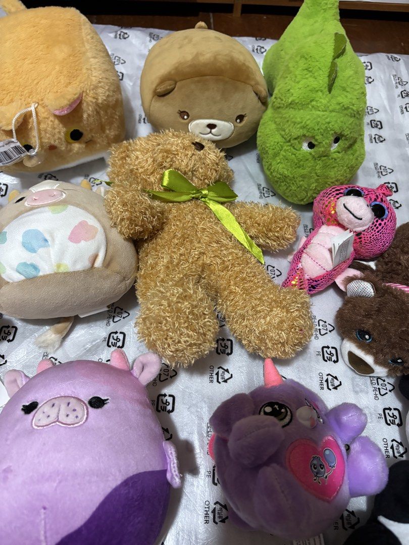 Assorted Plush Toys and Squishmallows (Category: Plushies & Soft Toys) located in Manila. Submitted by wardrobeinmnl (Listing ID 1467110991, Image 3). Description: - Variety of adorable plushies: Squishmallows cow and pig, penguin, brown bear with green ribbon, green dinosaur, and more - Made with ultra-soft, huggable materials - Open to buying as a whole set or picking individual favorites - PM for inquiries or to check availability!.