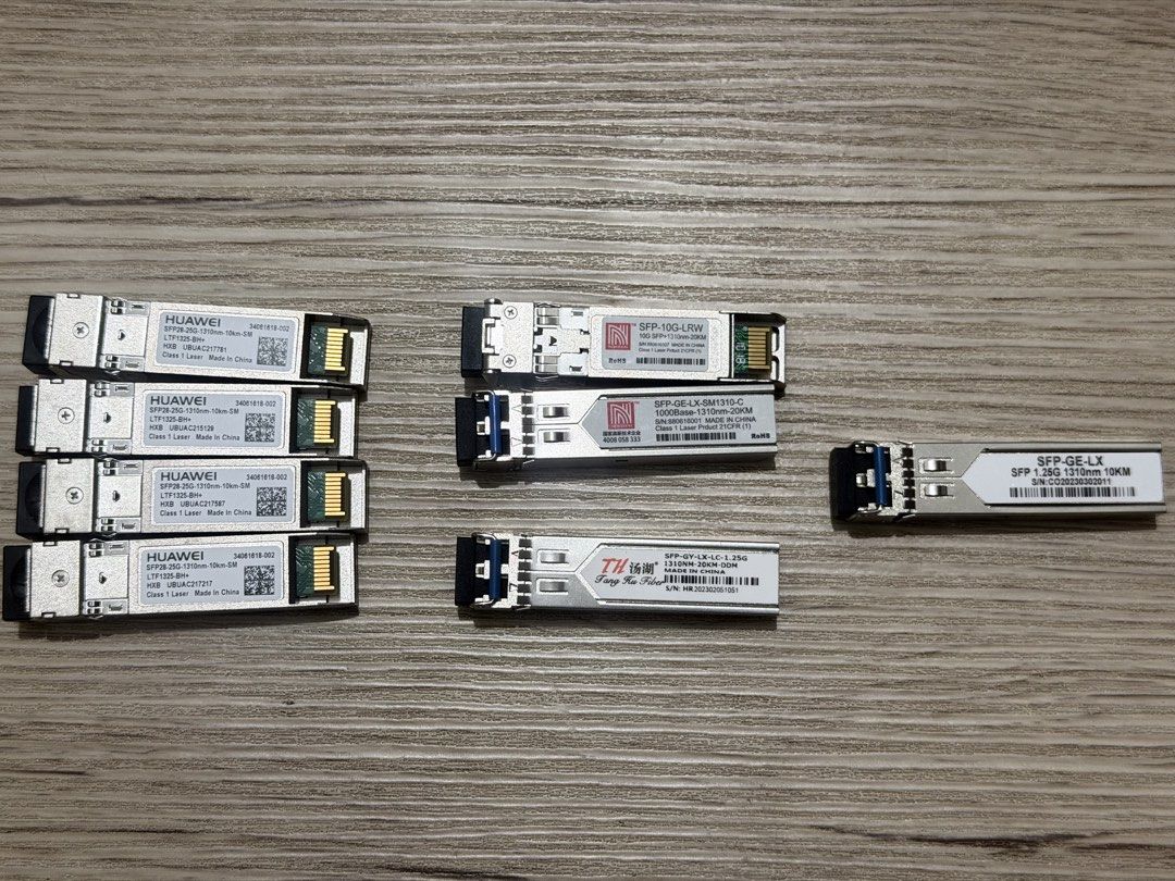 Assorted SFP, SFP+, and SFP28 Fiber Optic Transceiver Modules (Category: Computer Parts) located in Manila. Submitted by safestorm.886e55 (Listing ID 1467116089, Image 1). Description: Collection of various fiber optic transceiver modules. Includes four Huawei SFP28 25G 1310nm 10km modules, Nokoxin 10G-LRW and SFP-GE-LX-SM1310-C modules, Tang Ku Fiber SFP-GY-LX-LC-1.25G, and a generic SFP-GE-LX 1.25G 1310nm 10km module. All units clearly labeled 