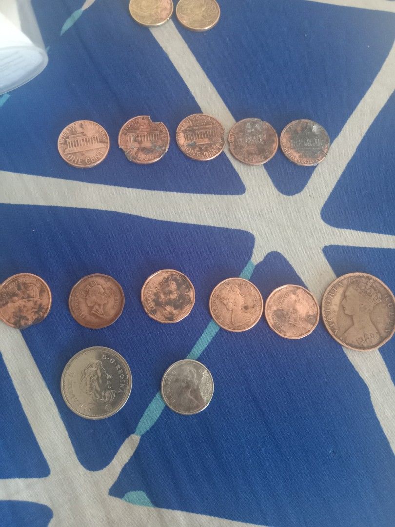 Assorted Vintage Foreign and US Coins Collection (Category: Vintage Collectibles) located in Mandaluyong City. Submitted by mysticwolf_54963c (Listing ID 1467032875, Image 1). Description: - Mixed coin lot: US quarters, dimes, nickels, pennies, Canadian, and Philippine currency - Includes vintage pieces featuring Queen Victoria and Elizabeth II - Condition: Mixed, shows natural circulation wear, toning, and tarnish - Perfect for beginner coin col