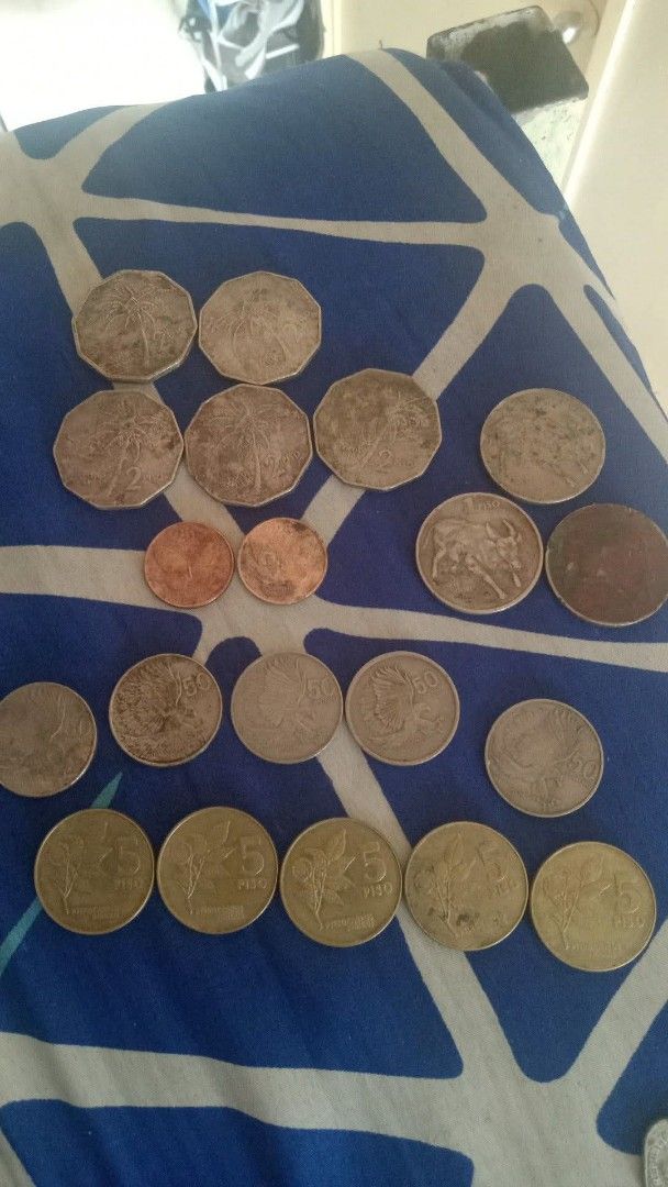 Assorted Vintage Foreign and US Coins Collection (Category: Vintage Collectibles) located in Mandaluyong City. Submitted by mysticwolf_54963c (Listing ID 1467032875, Image 3). Description: - Mixed coin lot: US quarters, dimes, nickels, pennies, Canadian, and Philippine currency - Includes vintage pieces featuring Queen Victoria and Elizabeth II - Condition: Mixed, shows natural circulation wear, toning, and tarnish - Perfect for beginner coin col