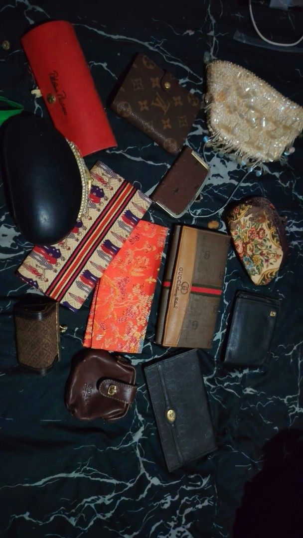 Assorted Vintage Wallets Purses Pouches and Cases Lot (Category: Purses & Pouches) located in Caloocan City. Submitted by chuaniki (Listing ID 1467154452, Image 1). Description: - Bundle includes assorted wallets, coin pouches, eyeglass cases, and small bags - Features designer items from Gucci and Louis Vuitton - Includes a variety of patterned cloth and leather pieces - Multiple styles and sizes available in the lot - Perfect mix of accessories