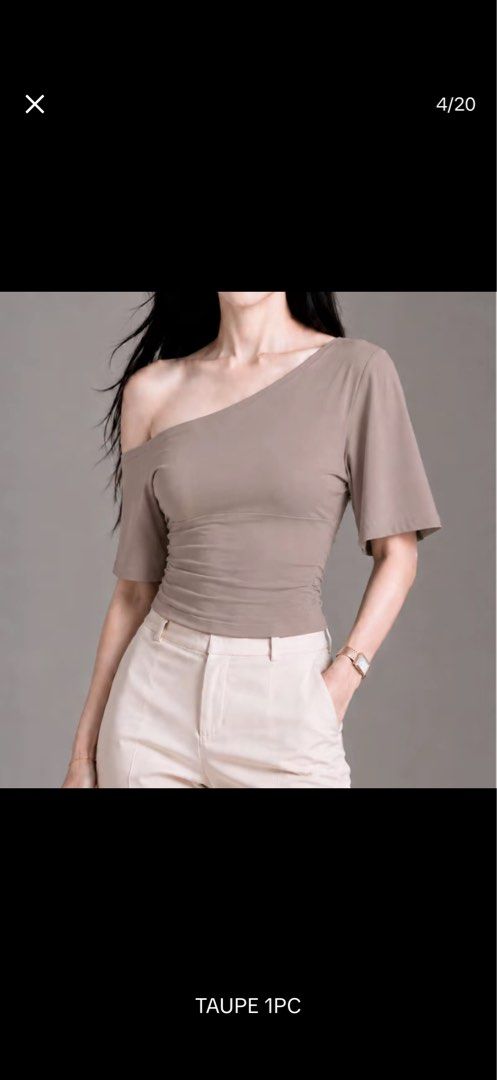 Asymmetrical Half Sleeve Top Available In Multiple Colors (Category: Blouses) located in Taguig. Submitted by heyitsfrann (Listing ID 1467135818, Image 3). Description: - Style: Off-shoulder or asymmetrical one-shoulder top - Fit: Form-fitting through the torso with half sleeves - Material: Soft and semi stretchy fabric - Colors available: Black, emerald green, taupe, and maroon - Styling: Perfect to pair with trousers or skirts for a clean, chic