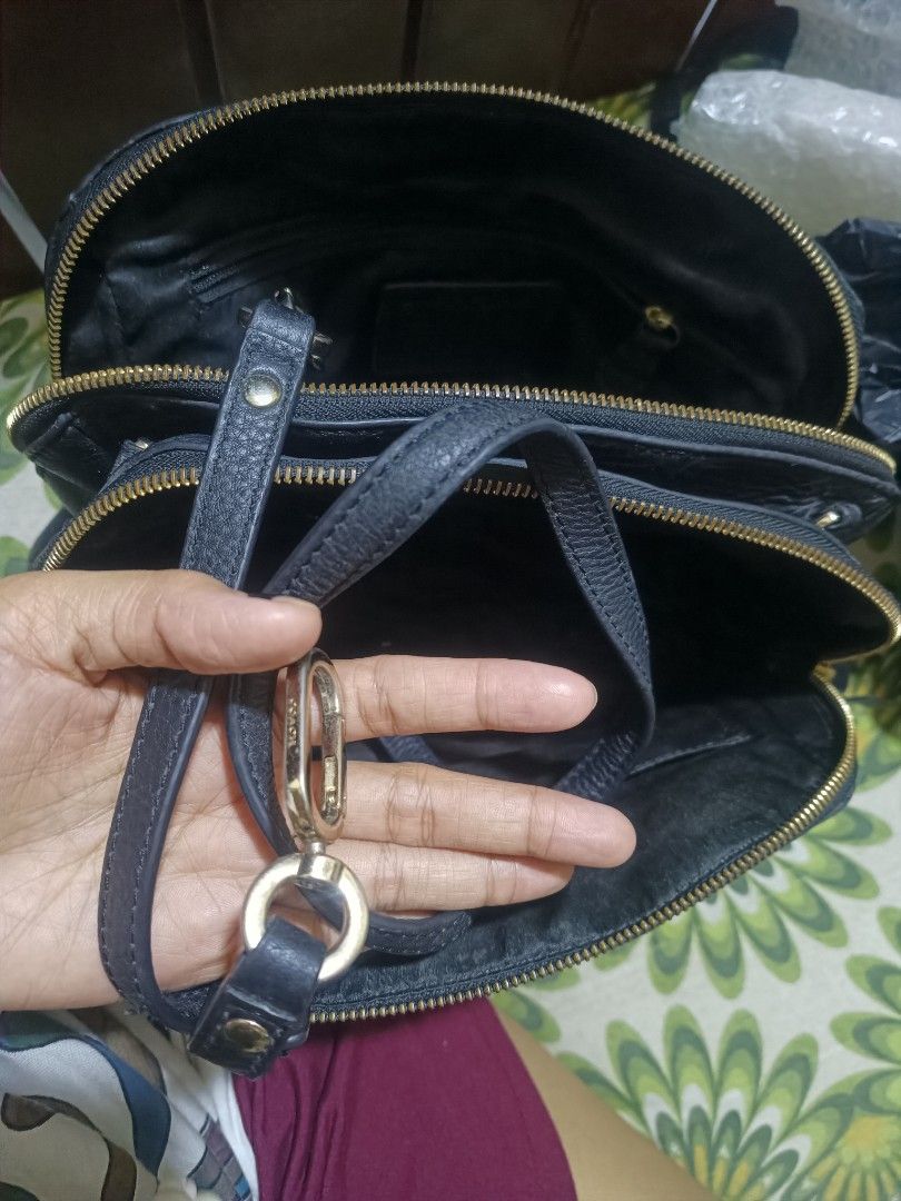 Authentic Black Leather Coach Shoulder Bag (Category: Luxury Bags & Wallets) located in Cebu City. Submitted by elen30abalo (Listing ID 1467082968, Image 3). Description: - Authentic black pebbled leather Coach bag - Elegant gold hardware and matching leather hangtag - Multiple interior zippered compartments for easy organization - Clean interior fabric lining - Comfortable double strap drop for shoulder wear - Ideal everyday size for your daily 