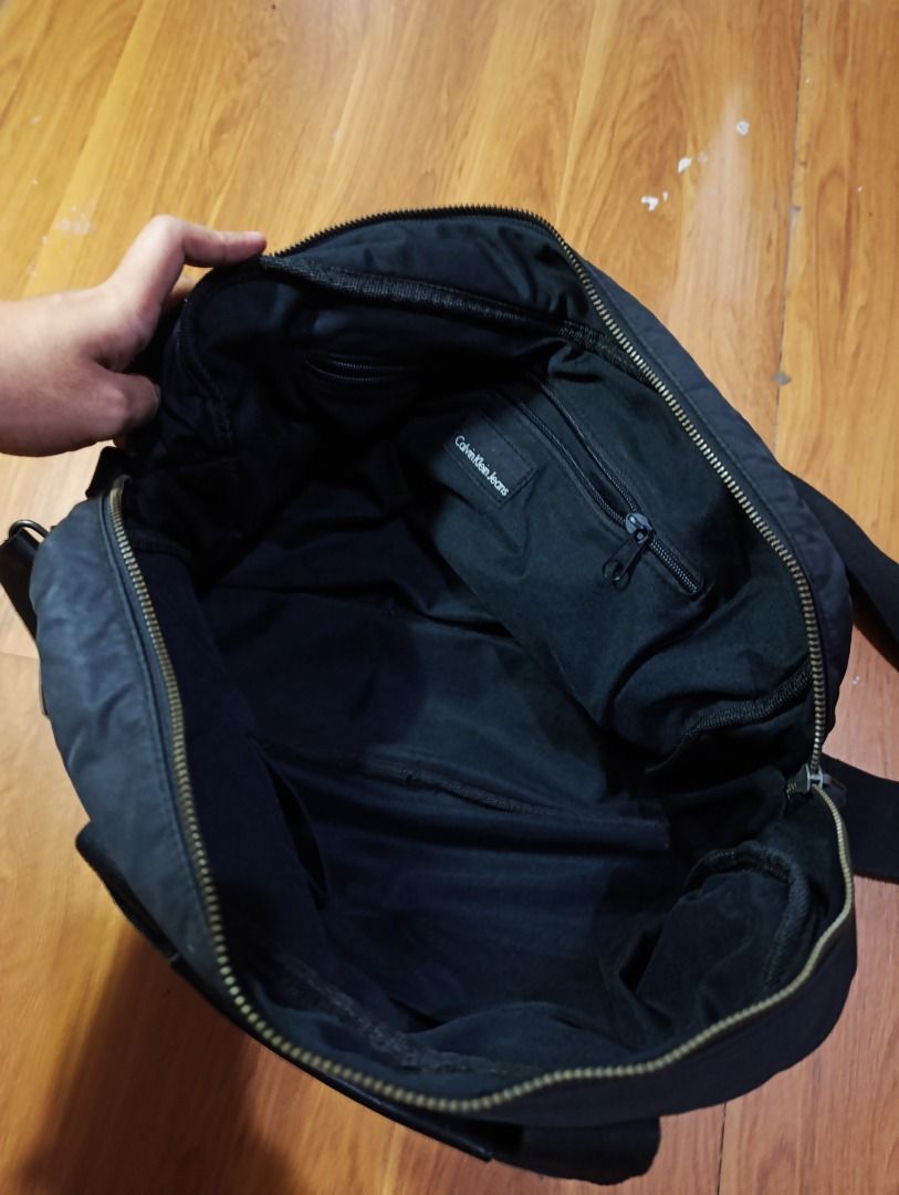 Authentic Calvin Klein Leather Messenger Sling Bag (Category: Sling Bags) located in Bulacan. Submitted by koritooo (Listing ID 1467129856, Image 3). Description: Authentic Calvin Klein Leather Messenger Sling Bag Good condition, small pinhole at the back issue 17 Width 14 Length .