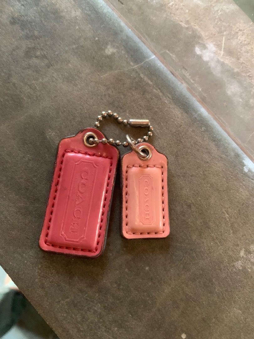Authentic Coach Pink Leather Hangtags Bag Charm (Category: Luxury Bags & Wallets) located in Piddig. Submitted by yhanshop (Listing ID 1467040855, Image 1). Description: - 100% genuine Coach leather hangtags - Colors: Hot pink and light pink - Includes attached metal ball chains - Features embossed Coach logo and stitched borders - Ideal replacement for missing bag charms or decorative keychains.