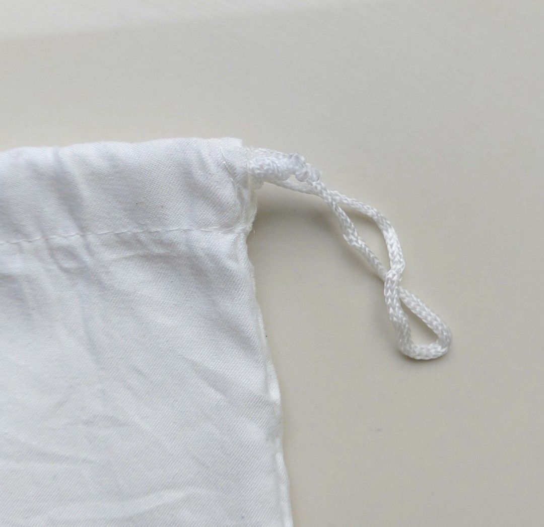 Authentic Furla white dust bag drawstring pouch (Category: Luxury Bags & Wallets) located in Lapu Lapu. Submitted by agnesapm_29813 (Listing ID 1467107062, Image 3). Description: - Authentic Furla white dust bag - Black printed logo: "Furla Since 1927 Italy" - Convenient single drawstring closure on the side - Dimensions: Roughly 11.5" x 10" - Ideal for protecting your luxury bags and accessories from dust.