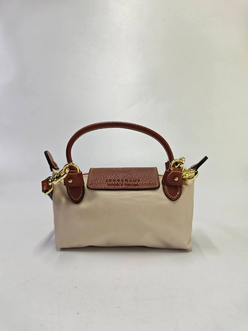 Authentic Longchamp Le Pliage Mini Sling Bag - Papier (Category: Cross-body Bags) located in Quezon City. Submitted by hollowwillow (Listing ID 1467032411, Image 3). Description: .