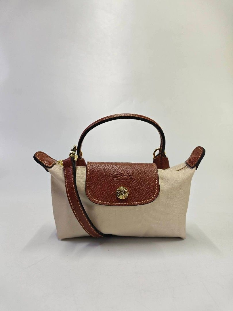 Authentic Longchamp Le Pliage Mini Sling Bag - Papier (Category: Cross-body Bags) located in Quezon City. Submitted by hollowwillow (Listing ID 1467032411, Image 1). Description: .
