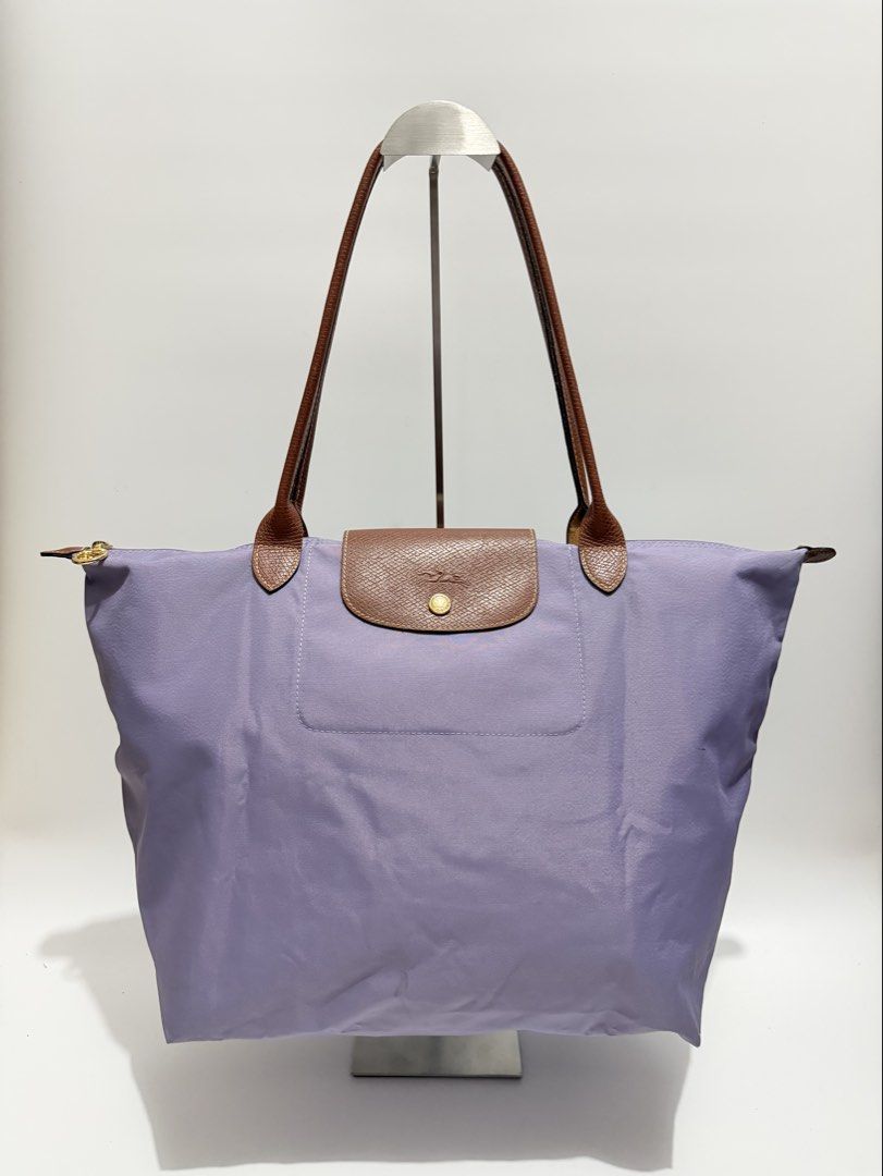 Authentic Longchamp Le Pliage Large Long Handle (Category: Tote Bags) located in Subic. Submitted by dear.jeveaph (Listing ID 1467089972, Image 1). Description: Authentic Longchamp Le Pliage Large Long Handle Minimal signs of use Needs wash ₱ 2000.00 Friendly reminder: This is a preloved bag. Please manage your expectations. If you want a flawless bag, buy one in the store. 😊.