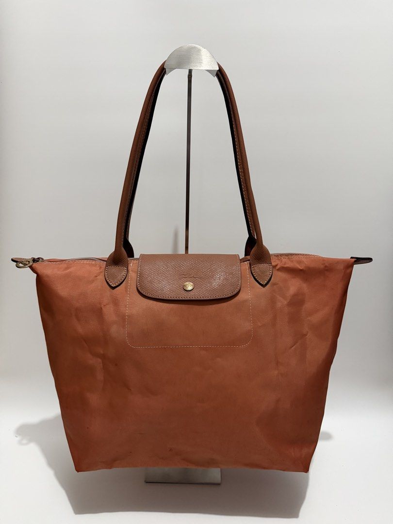 Authentic Longchamp Le Pliage Large Long Handle (Category: Tote Bags) located in Subic. Submitted by dear.jeveaph (Listing ID 1467091113, Image 1). Description: Authentic Longchamp Le Pliage Large Long Handle For Project bag only!! See photos for reference Dyed the bag red but turned out rust 🤣 ₱ 700.00 Friendly reminder: This is a preloved bag. Please manage your expectations. If you want a flawless bag, buy one in the store. 😊 .