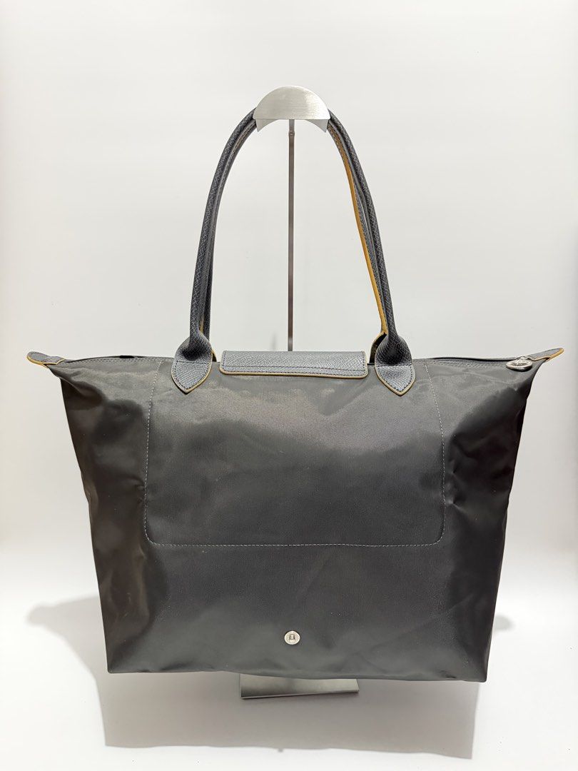 Authentic Longchamp Le Pliage Large Long Handle (Category: Tote Bags) located in Subic. Submitted by dear.jeveaph (Listing ID 1467095637, Image 2). Description: Authentic Longchamp Le Pliage Large Long Handle Like new condition ₱ 2500.00 Friendly reminder: This is a preloved bag. Please manage your expectations. If you want a flawless bag, buy one in the store. 😊.