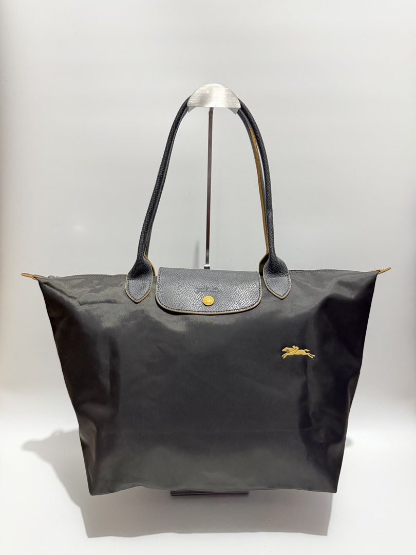 Authentic Longchamp Le Pliage Large Long Handle (Category: Tote Bags) located in Subic. Submitted by dear.jeveaph (Listing ID 1467095637, Image 1). Description: Authentic Longchamp Le Pliage Large Long Handle Like new condition ₱ 2500.00 Friendly reminder: This is a preloved bag. Please manage your expectations. If you want a flawless bag, buy one in the store. 😊.